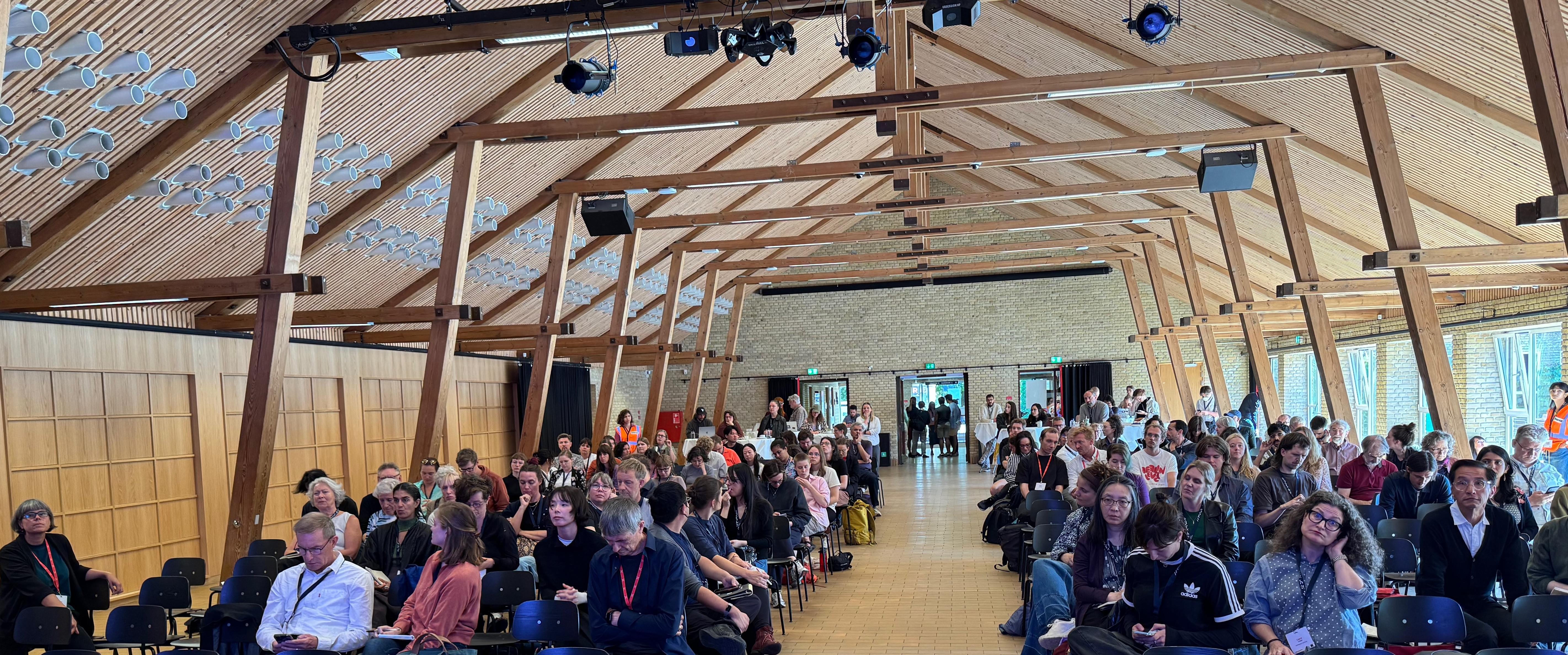 Waving to the conference audience from stage!