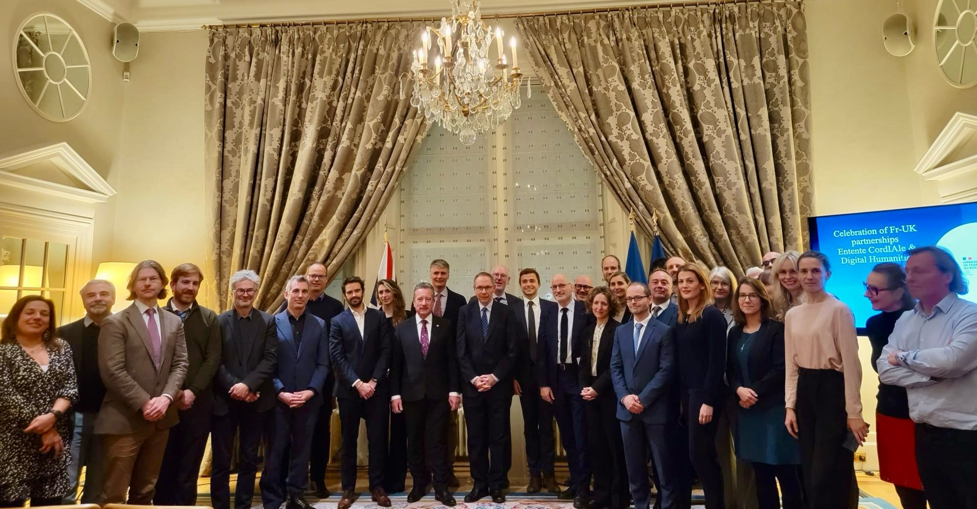 I managed to sneak into the group embassy picture by a literal nose