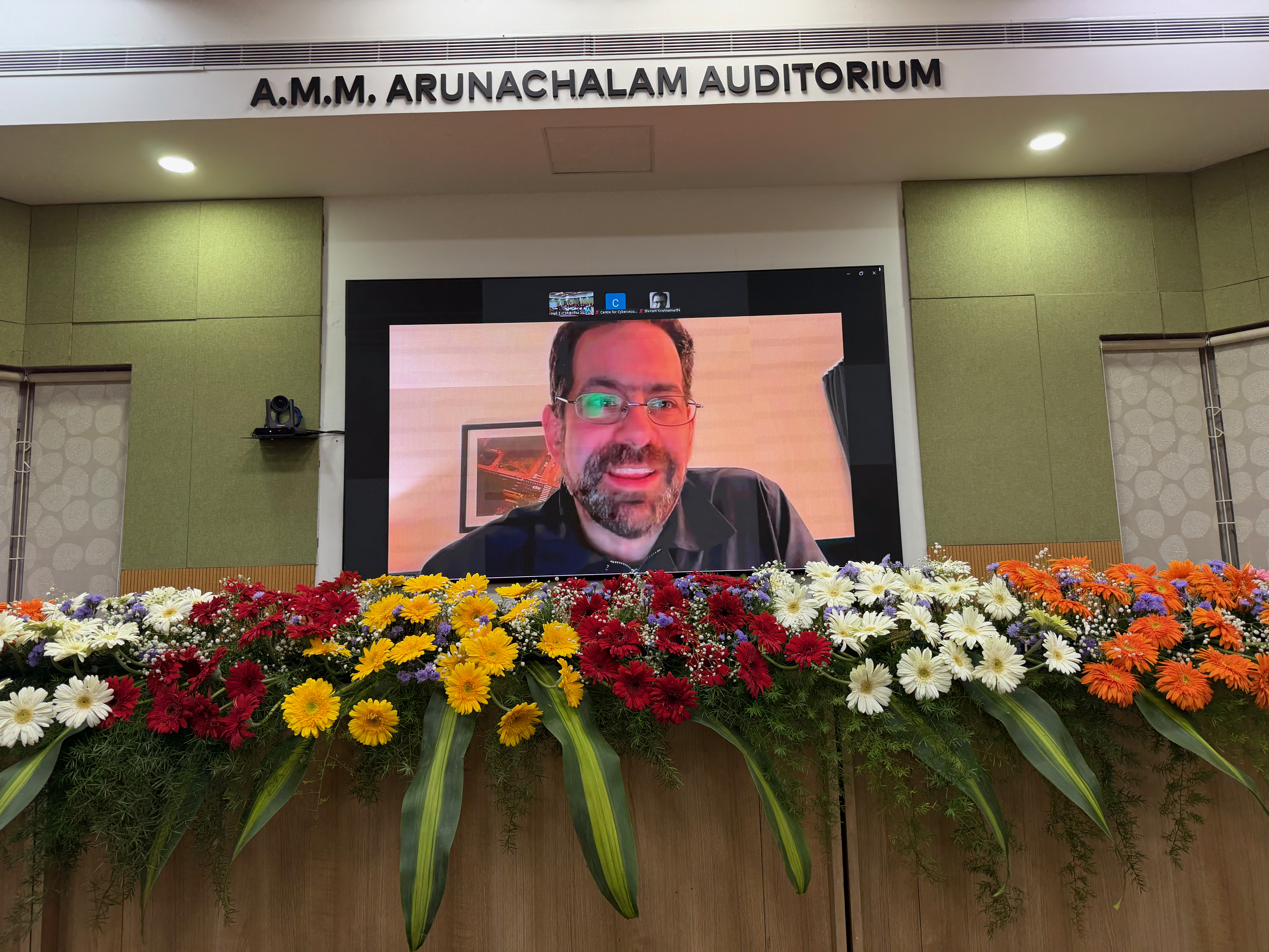 A giant Ron Minsky appears in the auditorium
