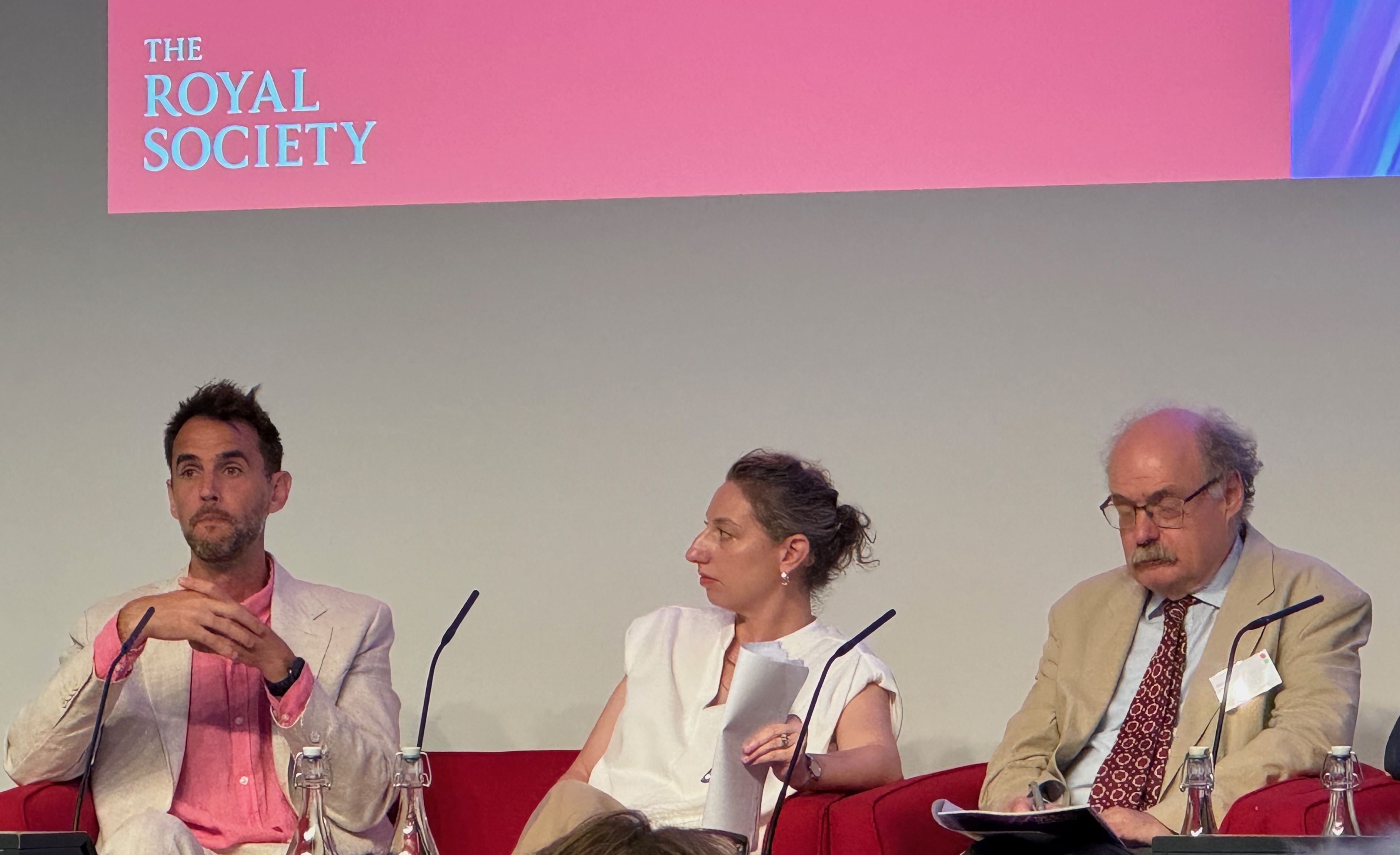 Jason Priem (OpenAlex), Victoria Eva (Elsevier) and Mark Walport in the panel